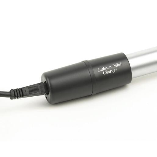A black lithium mini charger with a connected power cord, designed to provide a fast charge to compatible medical device handles.