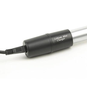 A black lithium mini charger with a connected power cord, designed to provide a fast charge to compatible medical device handles.