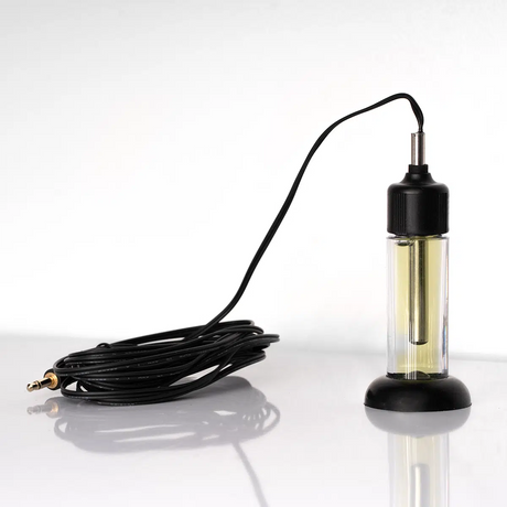 A WiFi datalogger with an external thermistor probe, placed next to a black cable, designed to mimic a vaccine temperature monitoring scenario.