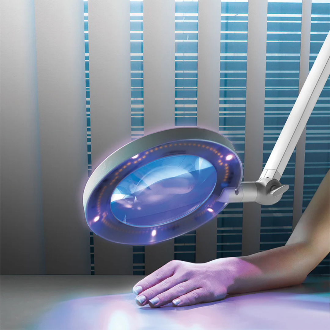 Hand under a magnifying medical supply light