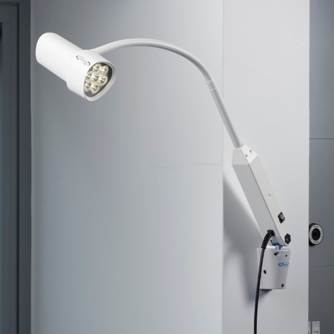 Medical examination light with wall attachment 