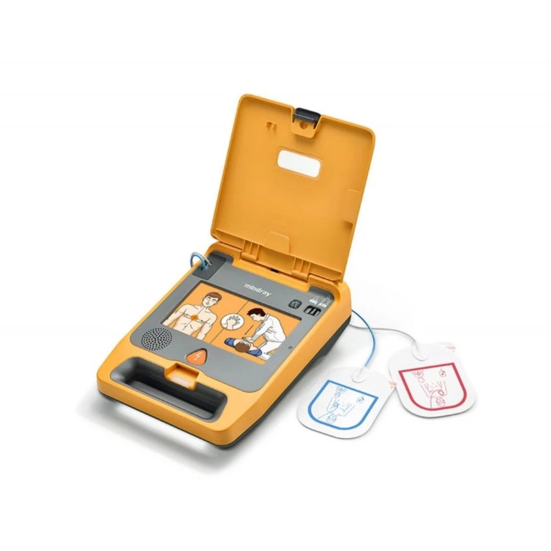 AED Defibrillator with open cover showing user interface and two electrodes on a white background