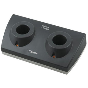 A black double lithium charger with two circular slots for charging devices, featuring LED indicators, and the brand name 'Keeler' printed on it.