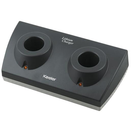 A black double lithium charger with two circular slots for charging devices, featuring LED indicators, and the brand name 'Keeler' printed on it.