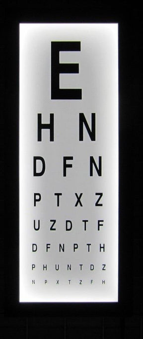 Illuminated wall-mounted eye test chart with LED lights, displaying a series of letters for vision testing.