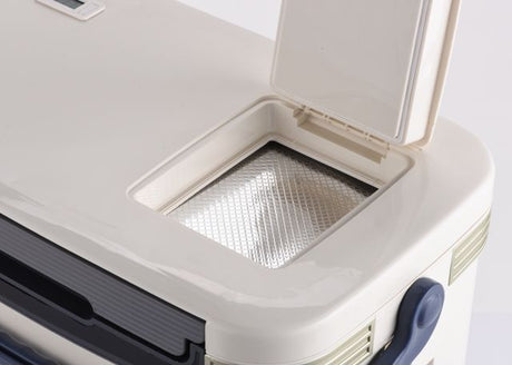 A beige Nomad Medical Cooler 28L with a black carrying handle and alarmed thermometer display on the top. The brand logo is printed on the front.