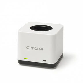 A single port desk charger for OPTICLAR VISIONMED rechargeable handpieces, featuring a white and black color scheme with the brand name on the front.