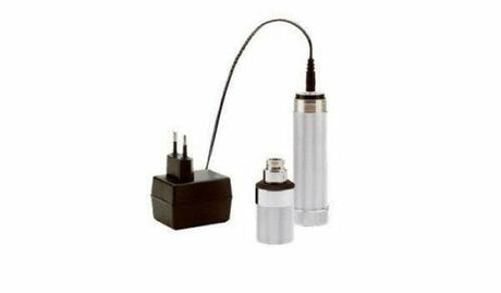 A Welch Allyn nickel-cadmium rechargeable 3.5V battery handle with charger, including a transformer and converter ring.